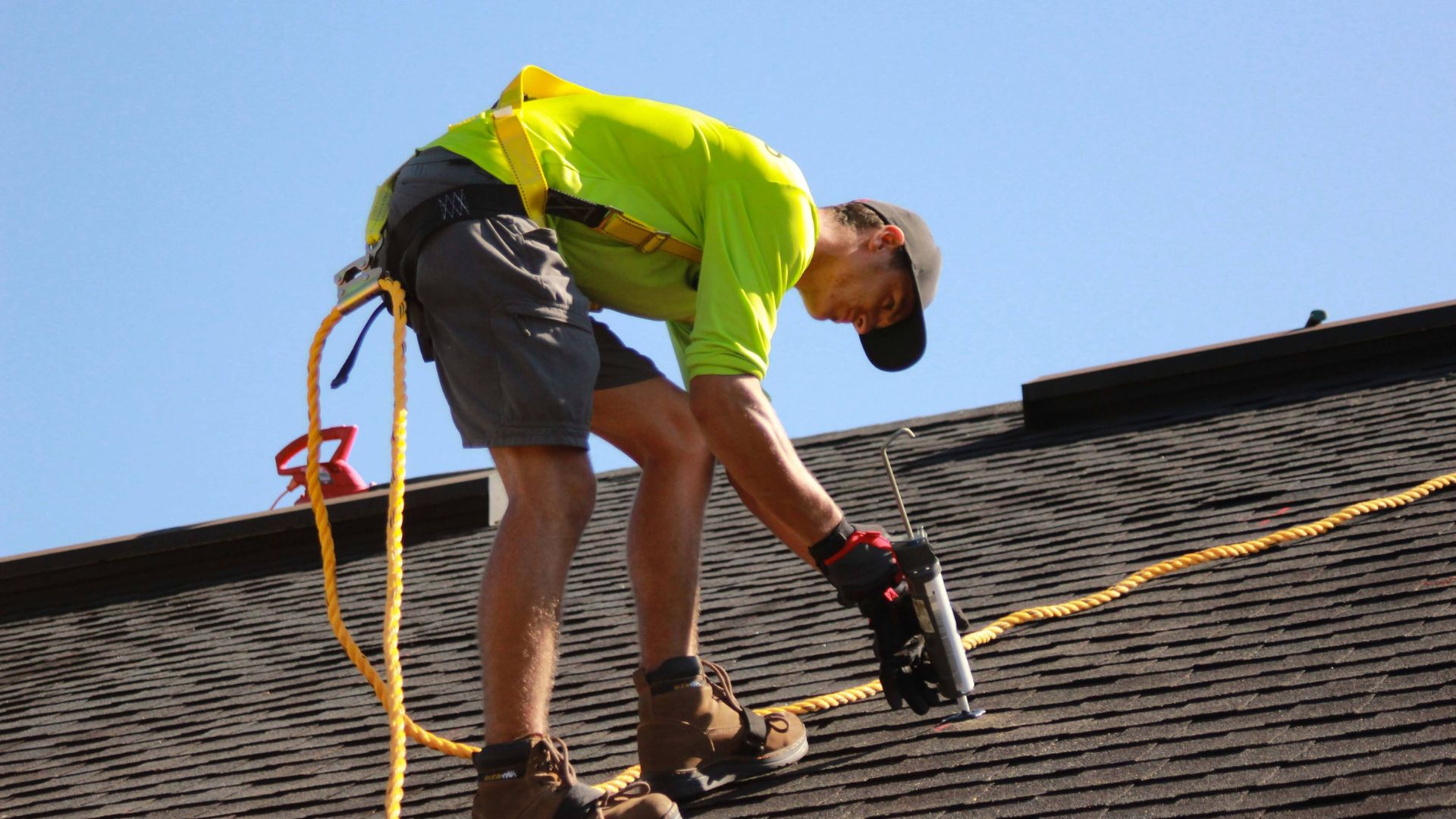 Contractor repairing a roof